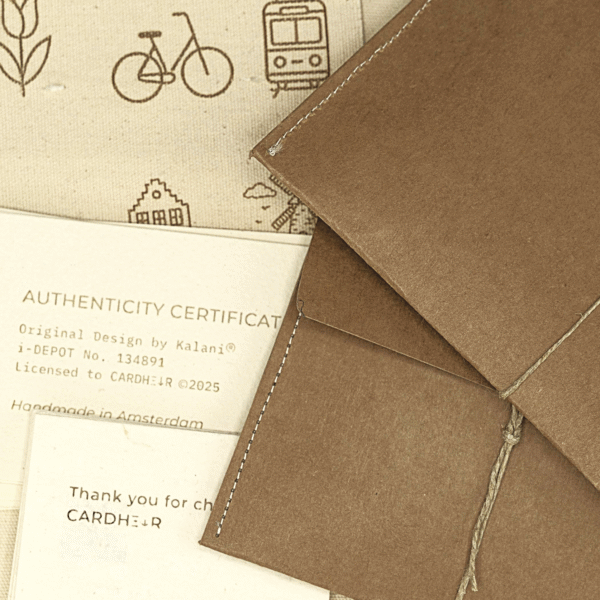 Handmade kraft envelope packaging for CARDHEIR – laser engraved, eco-friendly, with Amsterdam icon design