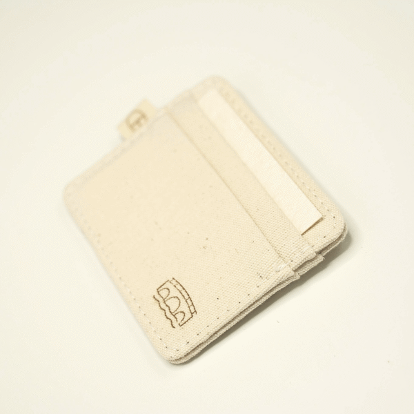 Rotated angled view of CARDHEIR Bruggen Edition cardholder – featuring a laser-engraved bridge icon on canvas