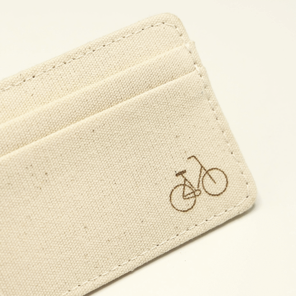 Closeup of the CARDHEIR Omafiets Edition handmade cardholder, showing a minimalist bike icon symbolizing Amsterdam's cycling heritage.