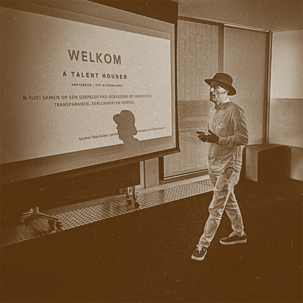 Reza Kalani presenting at an A Talent House® event in Amsterdam, sharing his vision on cultural connection and design philosophy.
