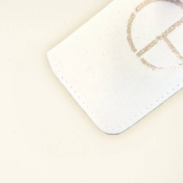 CARDHEIR Monogram Edition – back view of handmade canvas cardholder with engraved circle logo
