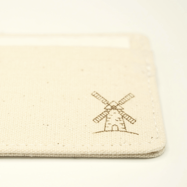Close-up of laser-engraved Dutch windmill on CARDHEIR handmade cardholder – Windmill Edition