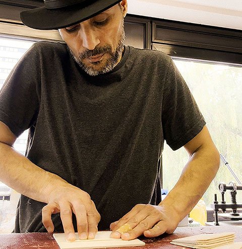 CARDHEIR is a handmade brand created by designer Reza Kalani – shown here in a square close-up during the crafting process in Amsterdam.