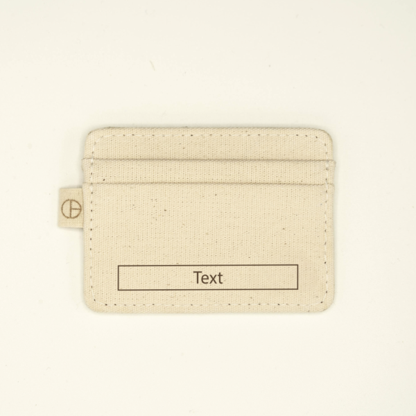 Natural canvas cardholder with a customizable laser-engraving area labeled "Text" on the lower front. Features tab with logo and clean stitching.
