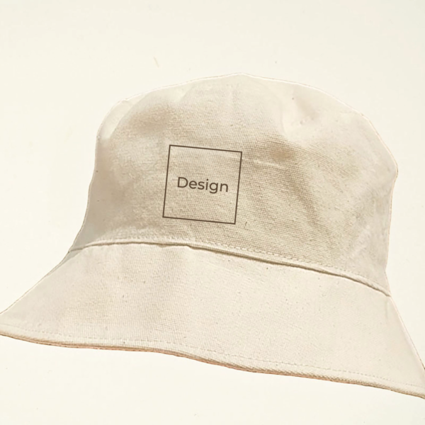 Undyed canvas bucket hat with a minimalist square custom laser engraving labeled “Design” on the front. Part of CARDHΞ↓R’s Variable Custom Edition collection.
