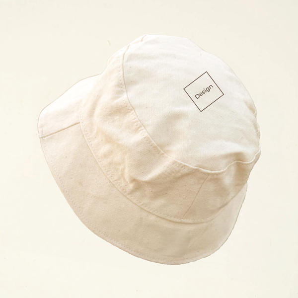 Undyed cotton bucket hat featuring a minimalist laser-engraved square labeled “Design” at the top crown. Part of CARDHΞ↓R’s Variable Custom Design collection.