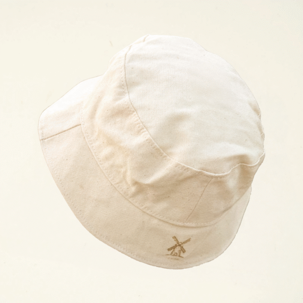 Undyed canvas bucket hat with a laser-engraved windmill symbol on the back brim. Part of CARDHΞ↓R’s Laser Carved Collection celebrating Dutch cultural icons.