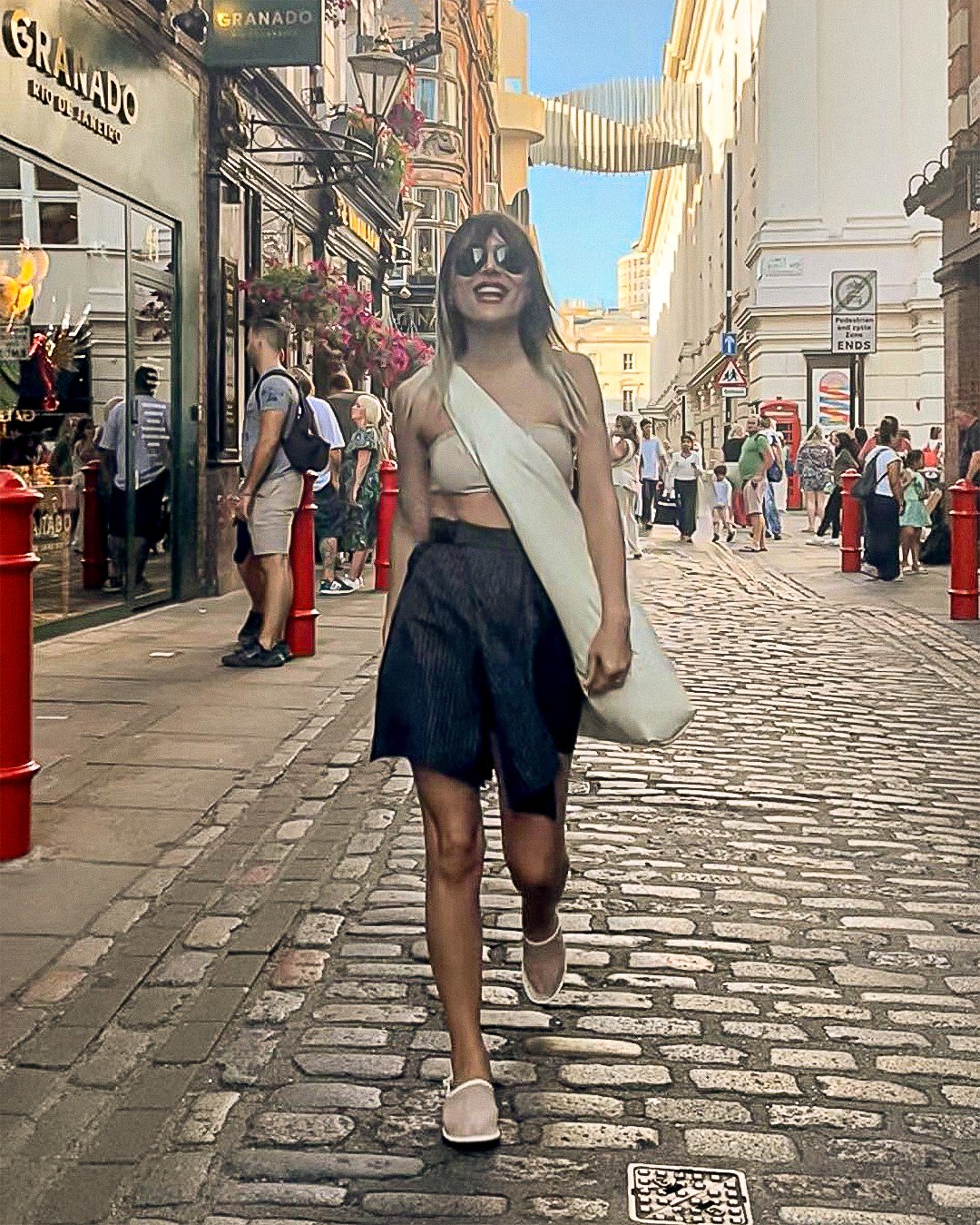 Sahar Tousi walking in London wearing a minimal chic outfit with CARDHΞ↓R