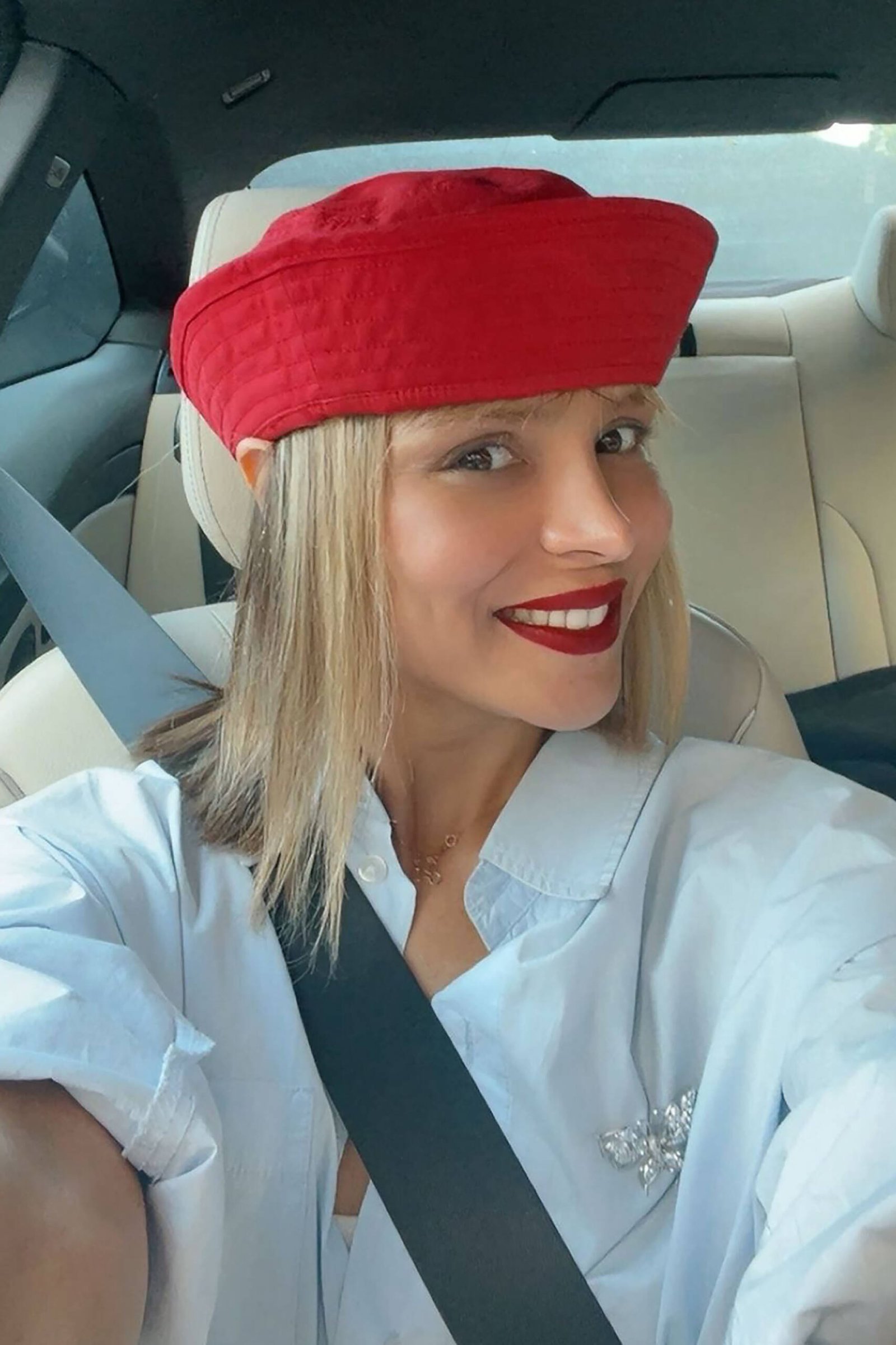 Sahar Tousi, London-based fashion designer, smiles in red beret – a CARDHΞ↓R supporter portrait