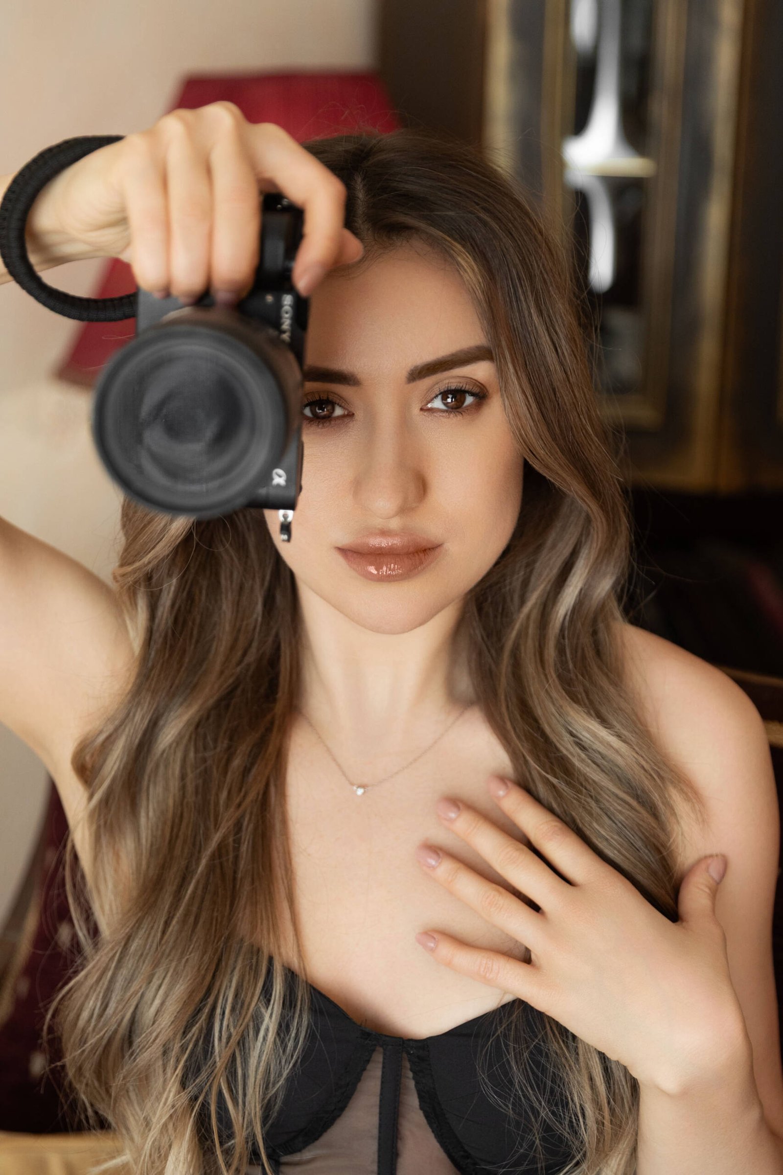 Valeria Fursenko holding a camera, photographed as part of the CARDHEIR project by Kalani in Amsterdam.