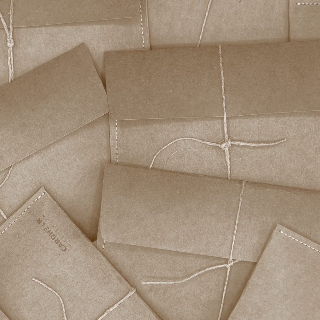 Handmade kraft paper envelope packaging for CARDHEIR, eco-friendly and crafted in Amsterdam.