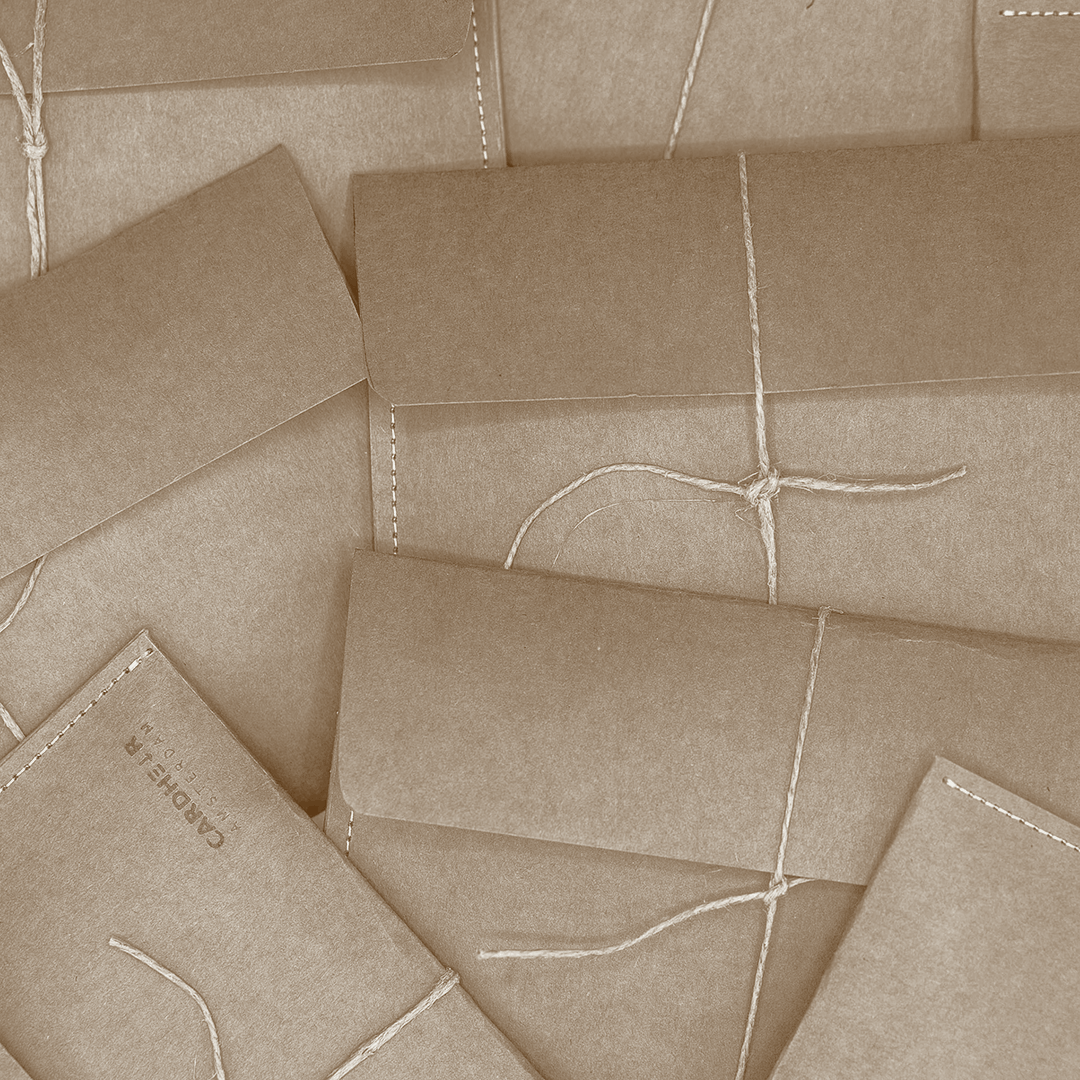 Handmade kraft paper envelope packaging for CARDHEIR, eco-friendly and crafted in Amsterdam.